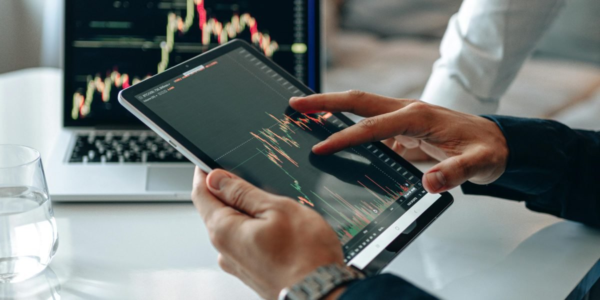 A professional intently analyzing graphs and charts, representing the challenge of quantifying AI innovation.