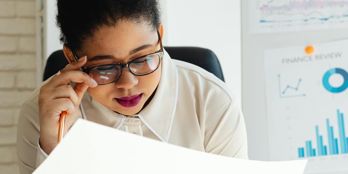 An executive carefully considering various options, symbolizing the challenge of choosing the right AI tools amidst information overload.