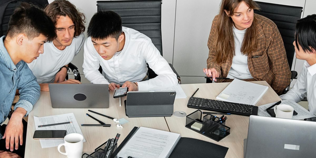 A team collaboratively evaluating different solutions, reflecting the thorough testing methodology.