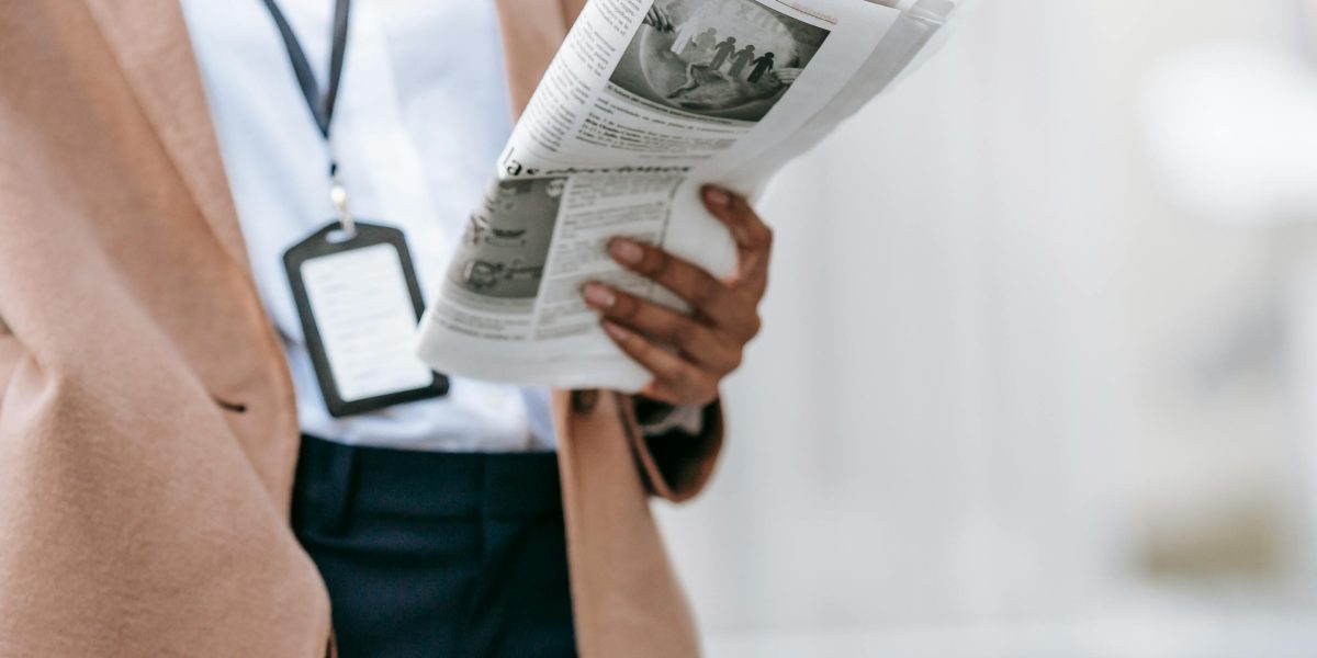 An individual staying informed by reading news and updates, adapting to the fast-evolving tech world and terminology changes.