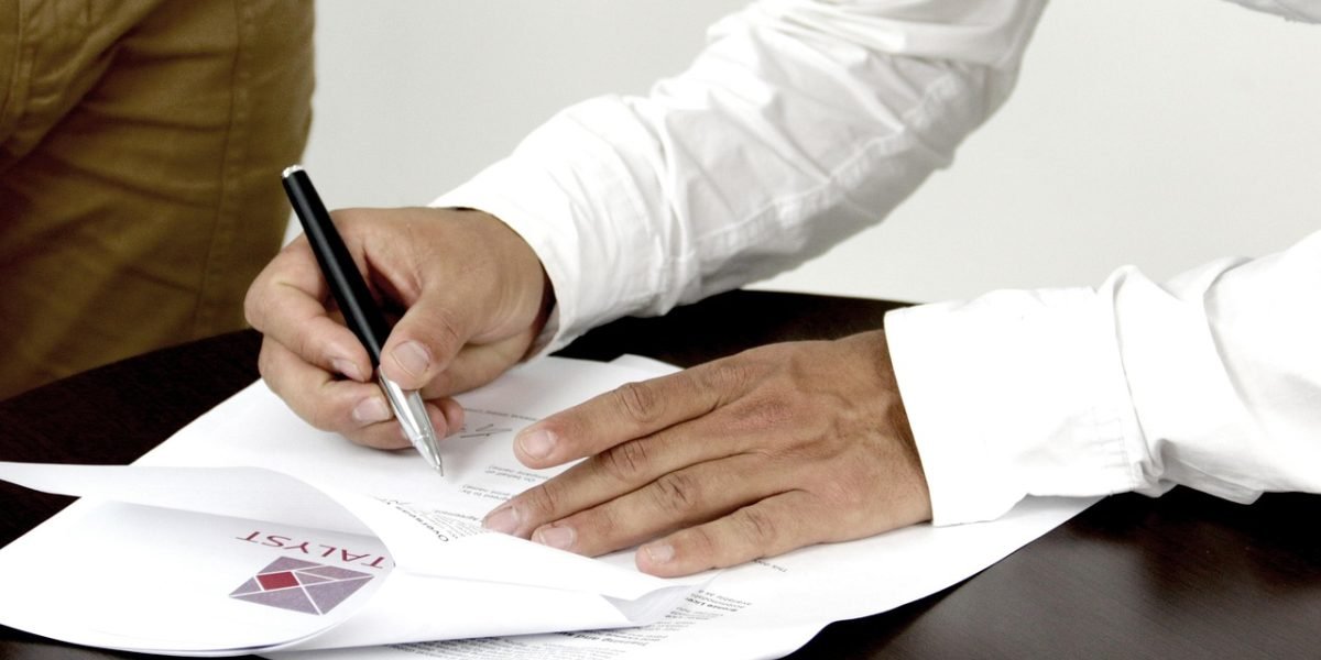 A person reviewing data or documents, representing the analytical process of A/B testing and iterating on job application strategies.