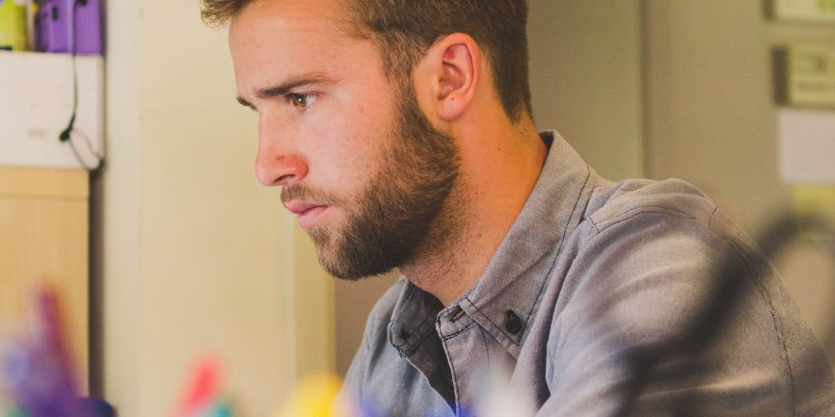 A person immersed in creative work, leveraging smart tools to bring ideas to life efficiently.