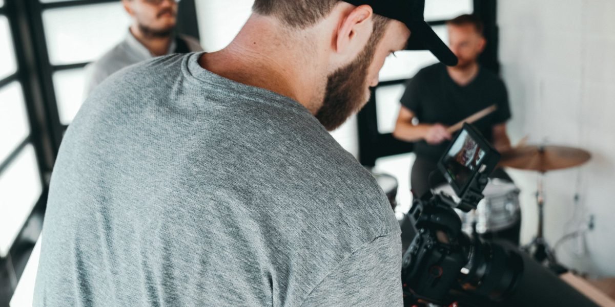 A filmmaker focused on refining video content, highlighting the post-production stage of creative work.