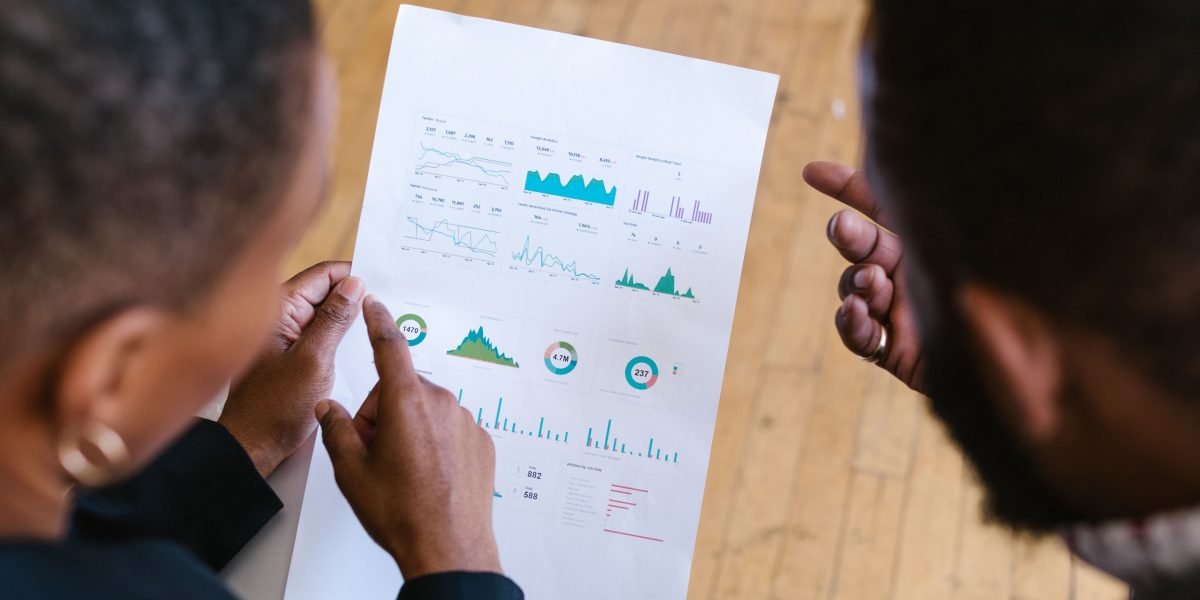 A team of professionals reviews energy reports, symbolizing efforts to improve efficiency in data center operations.