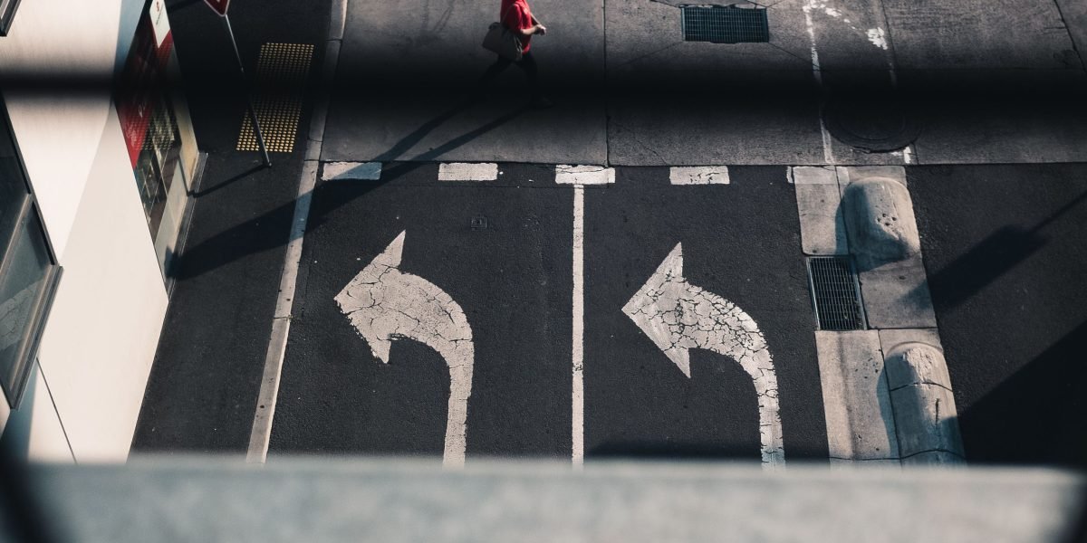 A person observes a bustling street with autonomous vehicles and smart infrastructure, highlighting sensor applications in urban environments.