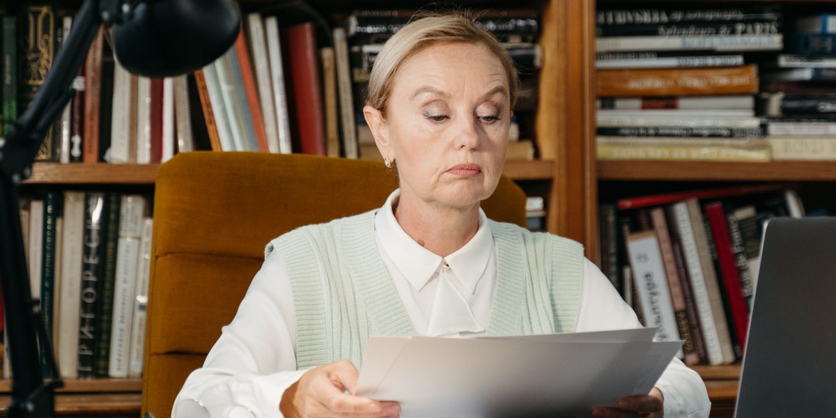 A person engrossed in research, symbolizing the deep dive into the history and evolution of AI detection.