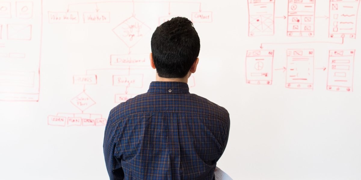 An individual processes complex information, reflecting how AI infographics distill data into easily digestible visuals.