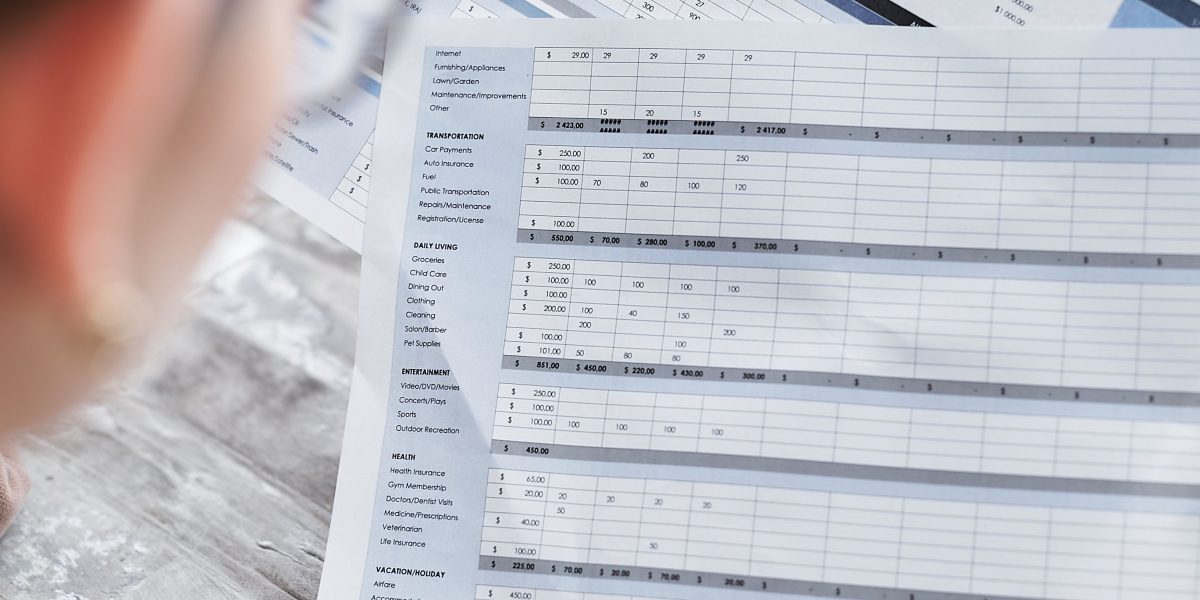 A person carefully reviewing documents and data, emphasizing the importance of diligence and credibility assessment.