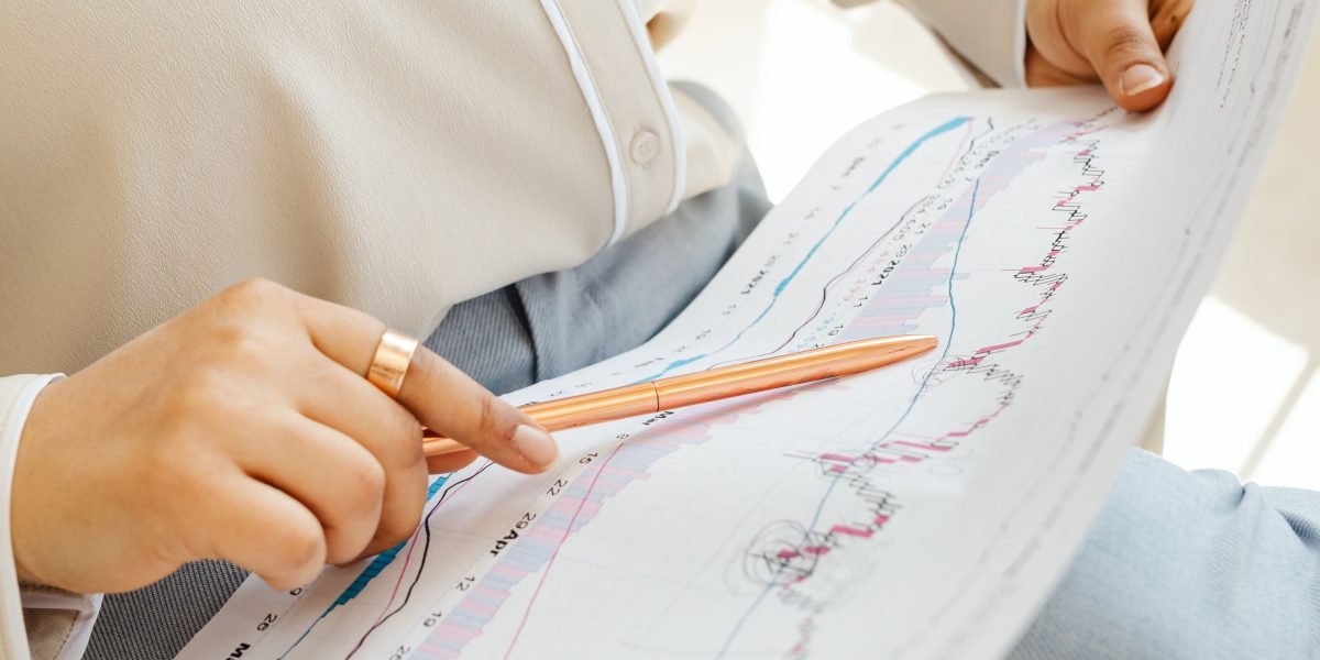 A professional analyzing complex data in a report to extract key insights for decision-making.