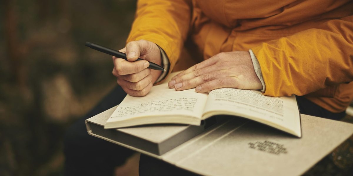 A person intently sifting through numerous documents and digital information, symbolizing the challenge of information overload in the AI market.