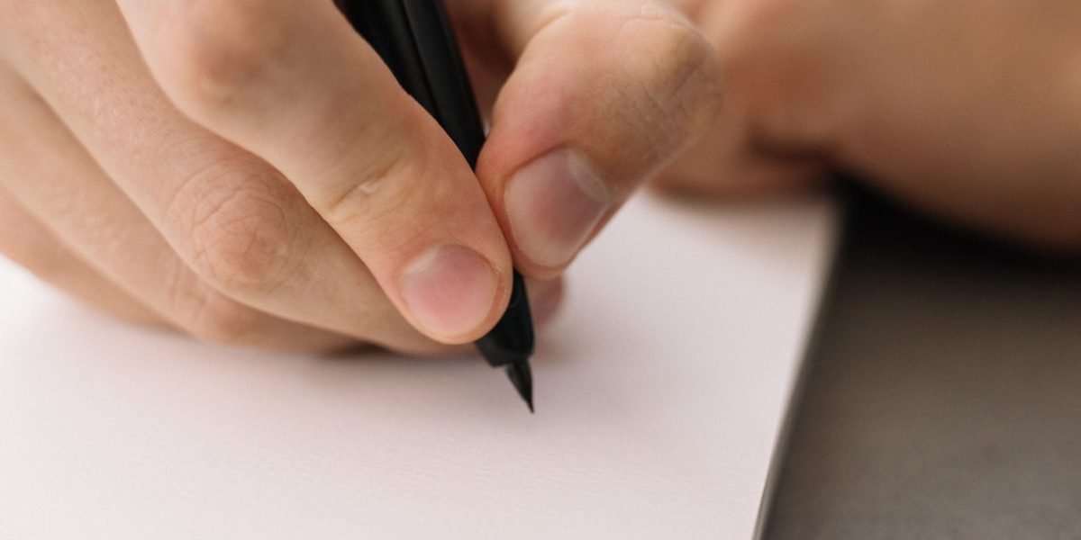 A business leader thoughtfully planning and outlining future goals, emphasizing actionable steps from insights.