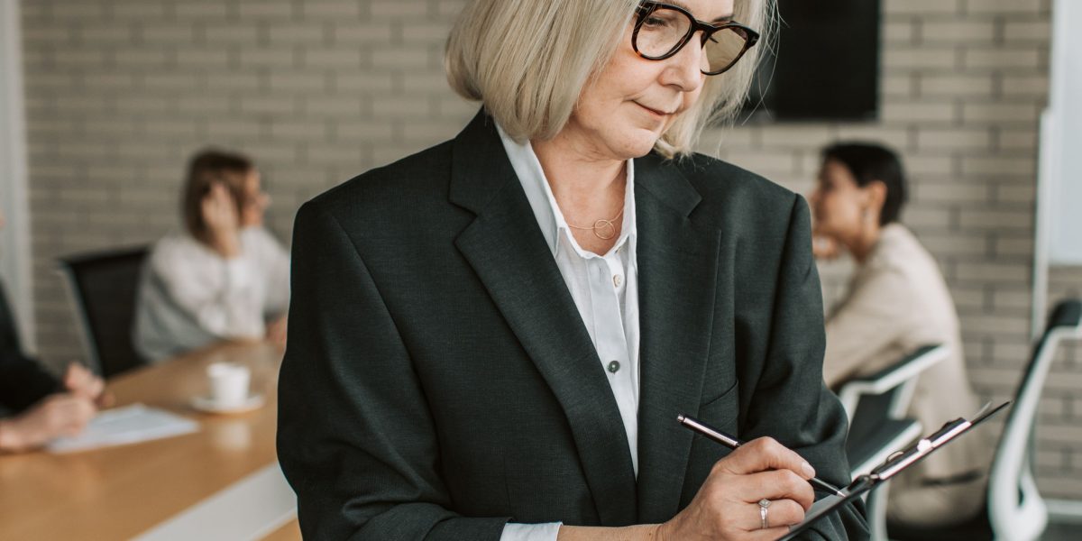 A business leader thoughtfully reviewing data to identify strategic investment opportunities.